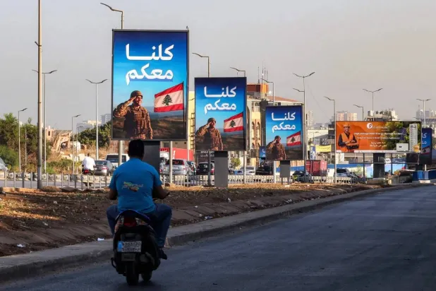 Banners on Beirut airport road voice support for Lebanese army (AFP)