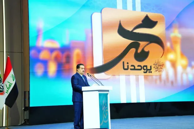 رئيس الحكومة العراقية محمد شياع السوداني خلال احتفال بالمولد النبوي في بغداد (إعلام حكومي)