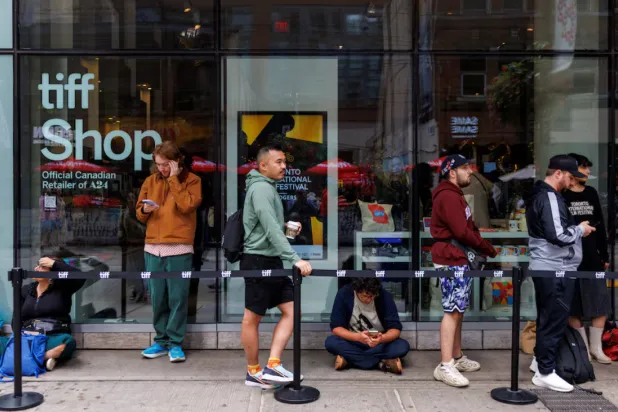 People wait in a rush line for tickets on Kings Street as the Toronto International Film Festival (TIFF) returns for its 50th edition in Toronto, Ontario, Canada September 4, 2025. REUTERS/Carlos Osorio 
