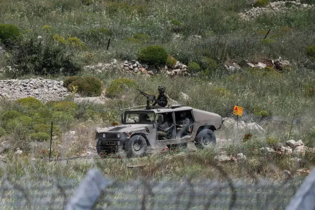 An Israeli military patrol near the border between the occupied Golan Heights and Syria on May 4, 2025. (Reuters) 