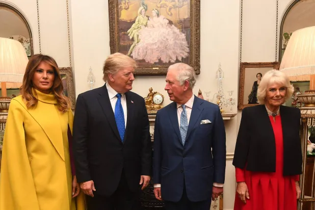 Britain's Prince Charles, Prince of Wales (2nd R) and Britain's Camilla, Duchess of Cornwall (R) meet US President Donald Trump (2nd L) and US First Lady Melania Trump (L) pose for a photograph at Clarence House in central London on December 3, 2019, ahead of the NATO alliance summit. (AFP)