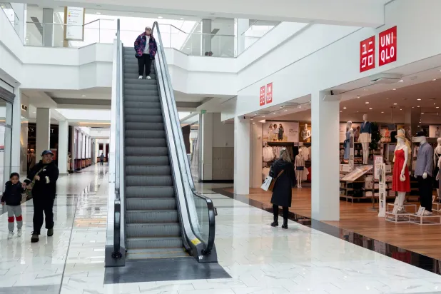 Shoppers walk past a Uniqlo store in a mall in Pennsylvania, US, April 3, 2025. (Reuters) 