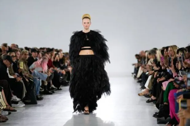 A model wears a creation part of Max Mara women’s Spring-Summer 2026 collection, presented in Milan, Italy, Thursday, Sept. 25, 2025. (AP Photo/Luca Bruno) 