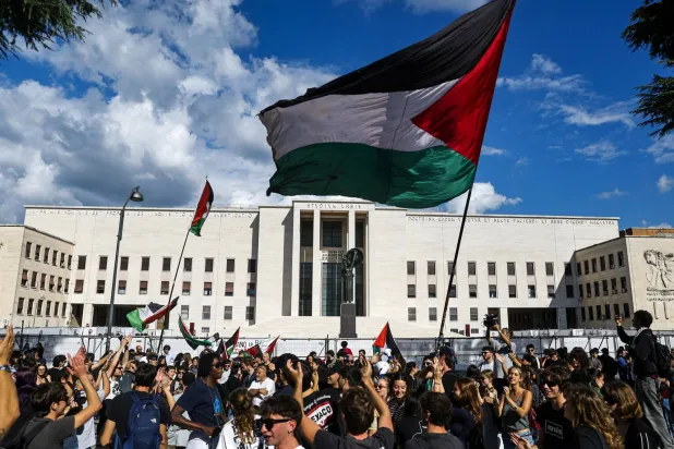 Participants wave Palestinian flags during a student demonstration in support of the Palestinian people and the Global Sumud Flotilla (GSF) at La Sapienza University in Rome, Italy, 30 September 2025. (EPA)
