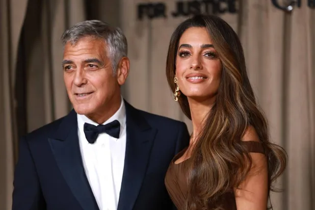 US actor George Clooney (L) and his wife, lawyer Amal Clooney (R) pose on the red carpet of The Albies Awards at the Natural History Museum in London, Britain, 03 October 2025. (EPA)