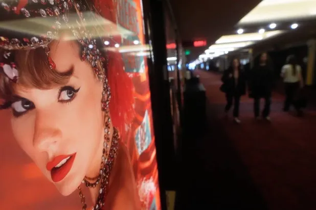  An poster promoting the official release party of Taylor Swift's new album, "The Life of a Showgirl," is displayed at the AMC Metreon in San Francisco, Friday, Oct. 3, 2025. (AP)