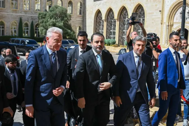 Syrian Foreign Minister Asaad al-Shaibani and his accompanying delegation arrive to meet Lebanese Prime Minister Nawaf Salam in Beirut (AFP)