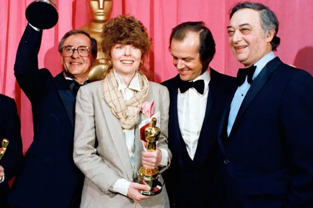 Oscar winners Charles H. Joffe, winner of best picture for "Annie Hall," left, and Diane Keaton, winner of best actress for "Annie Hall," poses with presenter Jack Nicholson, and producer Jack Rollins at the Academy Awards in Los Angeles on April 3, 1978. (AP)