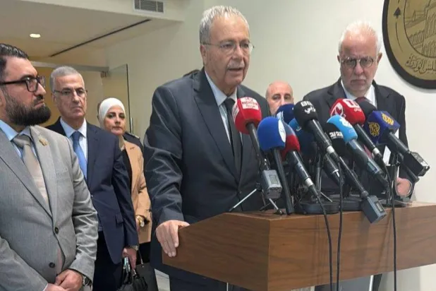 Lebanese Justice Minister Adel Nassar (R) and Deputy Prime Minister Tarek Mitri (C), Syrian Justice Minister Mazhar al-Wais (L) at a press conference in Beirut. (Asharq Al-Awsat) 