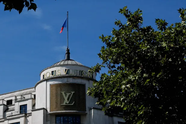 A Louis Vuitton logo is seen outside a store on the Champs-Elysees avenue in Paris, France, August 3, 2025. (Reuters)
