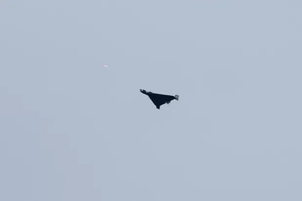 A Russian drone flies over the city as Ukrainian servicemen fire towards it during Russian drone and missile strikes, amid Russia's attack on Ukraine, in Kyiv, Ukraine September 28, 2025. (Reuters)