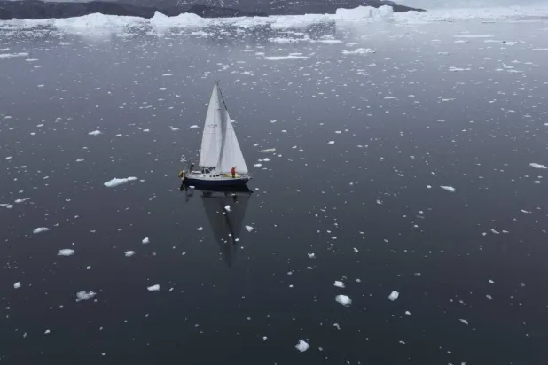 Brazilian sailor Tamara Klink poses on her sailboat 'Sardinha 2' as she completed her trip through the Northwest Passage. Tamara KLINK / Courtesy of Tamara Klink/AFP
