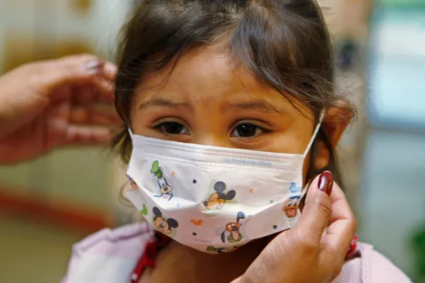 Lucile Packard Children’s Hospital at Stanford visitor Sheila Garcia, 3, wears before visiting a patient at the hospital in Palo Alto, Calif., Oct. 19, 2009. (AP Photo/Paul Sakuma, File)

