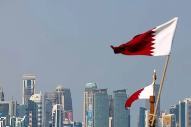 Qatari flag flutters in Doha - AAWSAT/File
