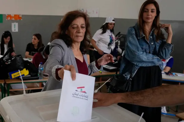A woman votes during the 2022 parliamentary elections in Tripoli, Lebanon. (AP)