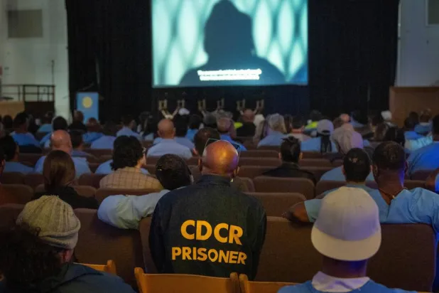 Inmates and guests watch a screening during the San Quentin Film Festival at the infamous California prison. Karl Mondon / AFP
