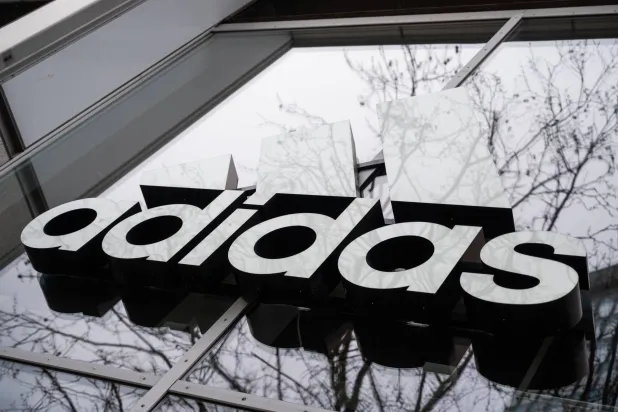 12 April 2021, Berlin: The Adidas logo is pictured on the façade of a building in Berlin. (dpa)
