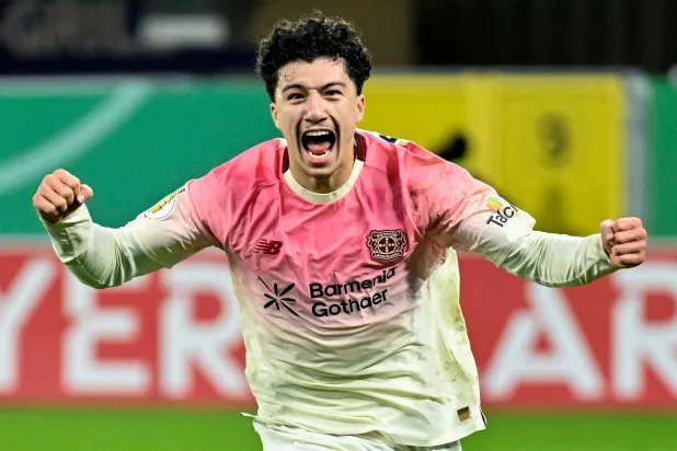 Bayer Leverkusen's Algerian midfielder #30 Ibrahim Maza celebrates scoring his team's third goal during the German Cup (DFB Pokal) second round football match between SC Paderborn and Bayer 04 Leverkusen in Paderborn, western Germany on October 29, 2025. Leverkusen won the match 4-2. (Photo by INA FASSBENDER / AFP) 
