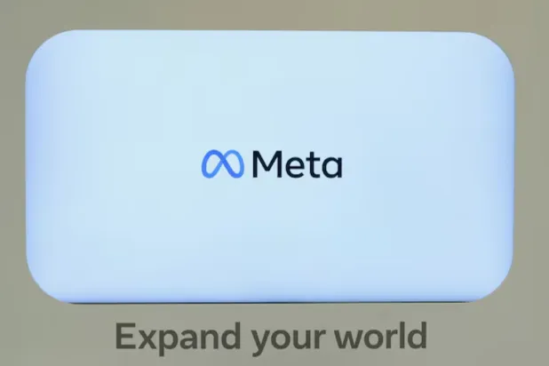 A logo of Meta appears on a screen at the company's House during the 55th annual meeting of the World Economic Forum in Davos, Switzerland, January 24, 2025. REUTERS/Yves Herman 