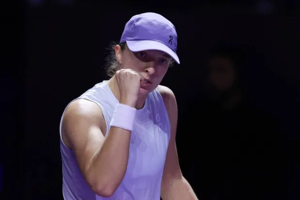Tennis - WTA Finals - Riyadh - King Saud University Indoor Arena, Riyadh, Saudi Arabia - November 1, 2025 Poland's Iga Swiatek celebrates after winning her round of 32 match against Madison Keys of the US. (Reuters) 