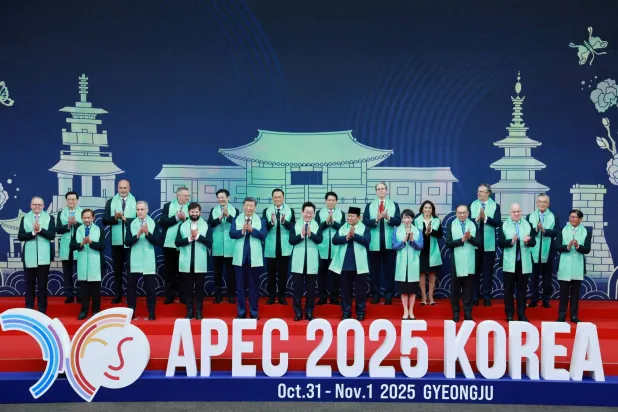 World leaders pose for a group photo during the Asia-Pacific Economic Cooperation (APEC) summit in Gyeongju, South Korea, November 1, 2025. Yonhap via REUTERS
