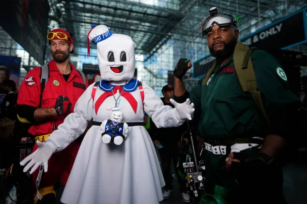 Attendees dressed as characters from Ghostbusters pose during New York Comic Con at the Jacob K. Javits Convention Center on Friday, Oct. 10, 2025, in New York. (Photo by Charles Sykes/Invision/AP)