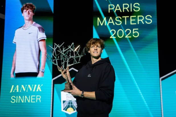 Jannik Sinner of Italy poses for photographs with the trophy after winning his final match against Felix Auger-Aliassime of Canada  at the ATP Paris Masters tennis tournament in Nanterre, outside Paris, France, 02 November 2025.  EPA/CHRISTOPHE PETIT TESSON