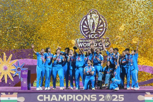  Indian players celebrate with the trophy after their win over South Africa in the ICC Women’s Cricket World Cup final match in Navi Mumbai, India, Sunday, Nov. 2, 2025. (AP Photo/Rafiq Maqbool)
