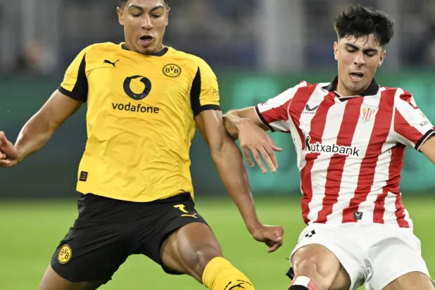 Borussia Dortmund midfielder Jobe Bellingham (L) has improved in recent weeks. INA FASSBENDER / AFP
