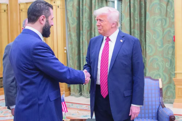  من لقاء ترمب والشرع بالرياض في مايو الماضي (أ.ب)