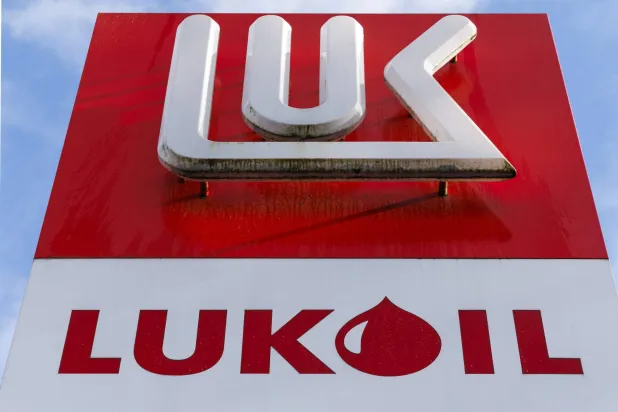 This photograph shows a Lukoil logo at a filling station in Gent on October 28, 2025. (AFP)