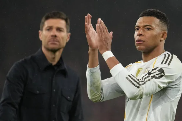 Real Madrid's head coach Xabi Alonso and Kylian Mbappe walk off the pitch after the Champions League soccer match between Liverpool and Real Madrid in Liverpool, England, Tuesday, Nov. 4, 2025. (AP)