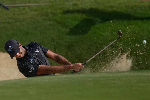 Aaron Rai of England hits a shot from a bunker on the 7th hole during the third round of the Abu Dhabi Golf Championship in Abu Dhabi, United Arab Emirates, Saturday, Nov. 8, 2025. (AP Photo/Altaf Qadri)