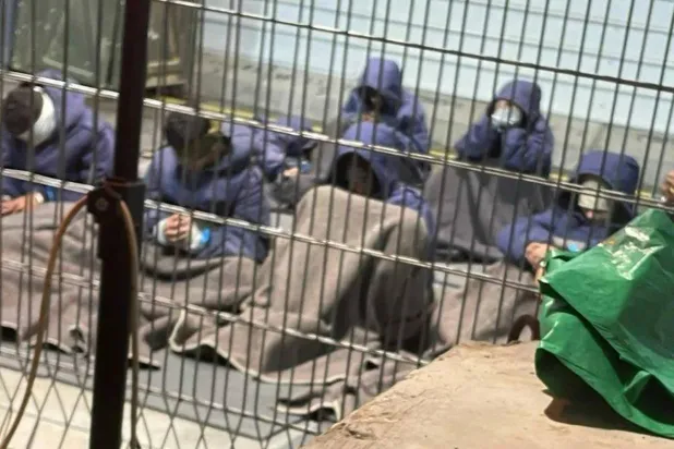 An undated photo from 2023 provided by a whistleblower shows Palestinian prisoners captured in the Gaza Strip at the Sde Teiman detention facility. (AP)