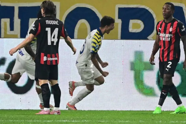 Enrico Del Prato (C) scored Parma's equalizer against AC Milan. Piero CRUCIATTI / AFP
