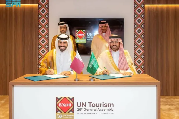 Saudi and Qatari officials are seen at the signing ceremony on Sunday. (SPA)