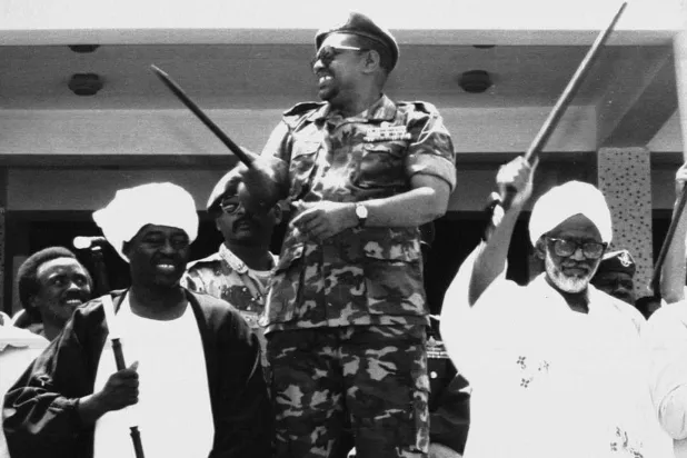  
Al-Bashir and al-Turabi (right) after the coup (AP)

