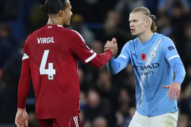 Liverpool captain Virgil van Dijk said his side will not give up despite a 3-0 defeat to Manchester City. Darren Staples / AFP
