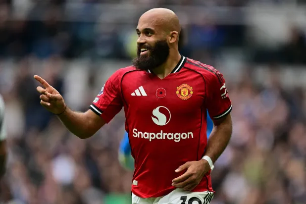 Manchester United's Cameroonian midfielder #19 Bryan Mbeumo celebrates after scoring the opening goal of the English Premier League football match between Tottenham Hotspur and Manchester United at the Tottenham Hotspur Stadium in London, on November 8, 2025. (AFP) 