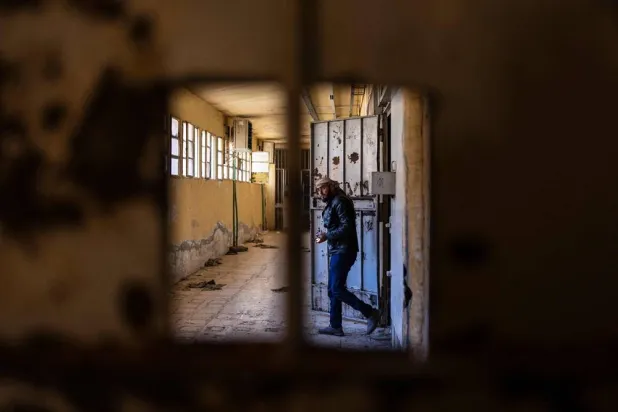 A Syrian man inspects cells at the prison of Sednaya, north of Damascus, Syria, Dec. 16, 2024. (AFP)