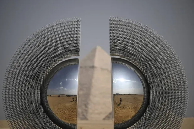 An art installation, "The Shen" by Mert Ege Kose, is displayed near the Giza pyramid complex, in Giza, Egypt, 11 November 2025. (EPA)