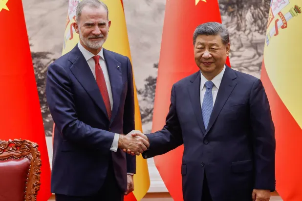 Spain's King Felipe VI and Chinese President Xi Jinping, right, shake hands after a signing ceremony at the Great Hall of the People in Beijing, China, Wednesday, Nov. 12, 2025. (Maxim Shemetov/Pool Photo via AP)
