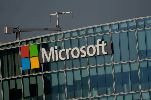FILE - The logo of Microsoft is seen outside its French headquarters in Issy-les-Moulineaux, outside Paris on May 13, 2024. (AP Photo/Thibault Camus, File)
