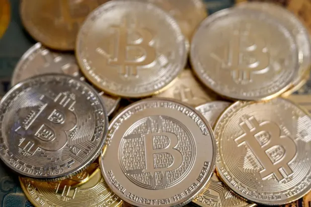 (FILES) This illustration photograph taken on November 22, 2024 in Istanbul shows coin imitations of Bitcoin. (Photo by Ozan KOSE / AFP)