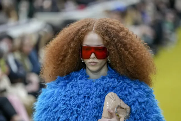 A model wears a creation as part of the Gucci women's Fall-Winter 2023-24 collection presented in Milan, Italy, Friday, Feb. 24, 2023. (AP Photo/Antonio Calanni)