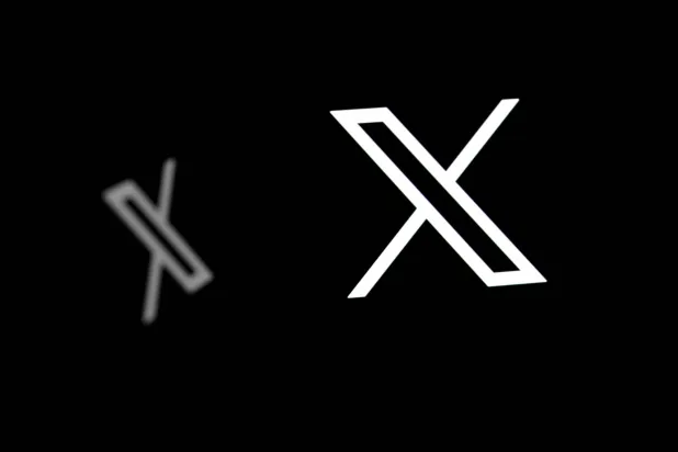 (FILES) This illustration photograph shows logos of X (formerly Twitter) social network in Brussels on September 29, 2025. (Photo by Nicolas TUCAT / AFP)