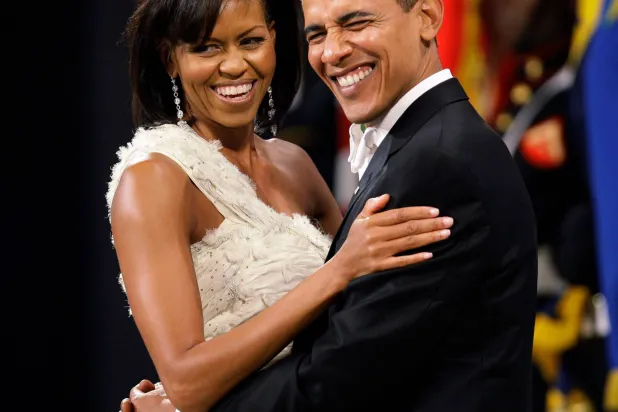 FILE - President Barack Obama and first lady Michelle Obama dance at the Obama Home States Inaugural Ball in Washington, Jan. 20, 2009. (AP Photo/Charlie Neibergall, File)