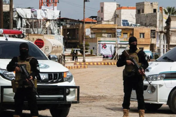 عنصران من الشرطة في سوريا (الشرق الأوسط)