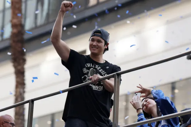 Nov 3, 2025; Los Angeles, CA, USA; Los Angeles Dodgers two-way player Shohei Ohtani acknowledges the crowd during the World Series championship parade at downtown Los Angeles. Mandatory Credit: Kiyoshi Mio-Imagn Images 