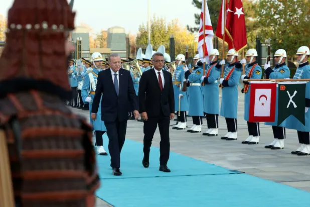 Türkiye President Tayyip Erdogan and Turkish Cypriot leader Tufan Erhurman attend a welcoming ceremony at the Presidential Palace in Ankara, Türkiye, November 13, 2025. Murat Cetinmuhurdar/PPO/Handout via REUTERS 